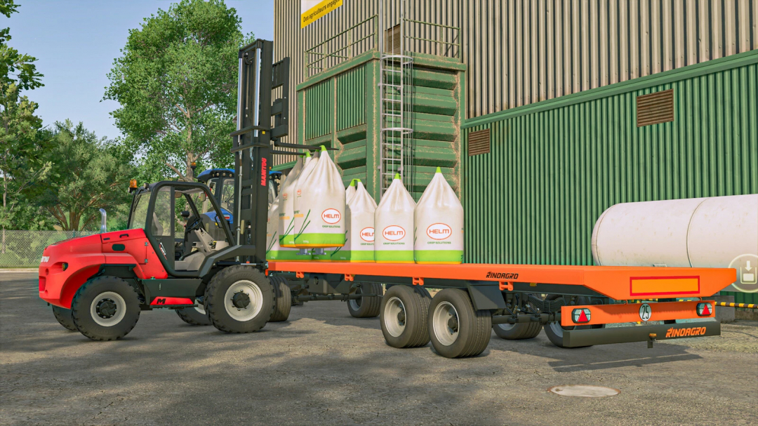 In Farming Simulator 25, a forklift loads HELM fertilizer bags onto an orange Rinoagro platform trailer next to a green industrial building with trees in the background.