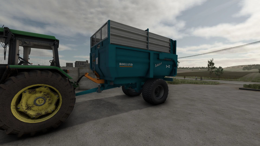 Farming Simulator 25 mod: Rolland TurboClassic 9-17 trailer attached to tractor, used for farming tasks in FS25.