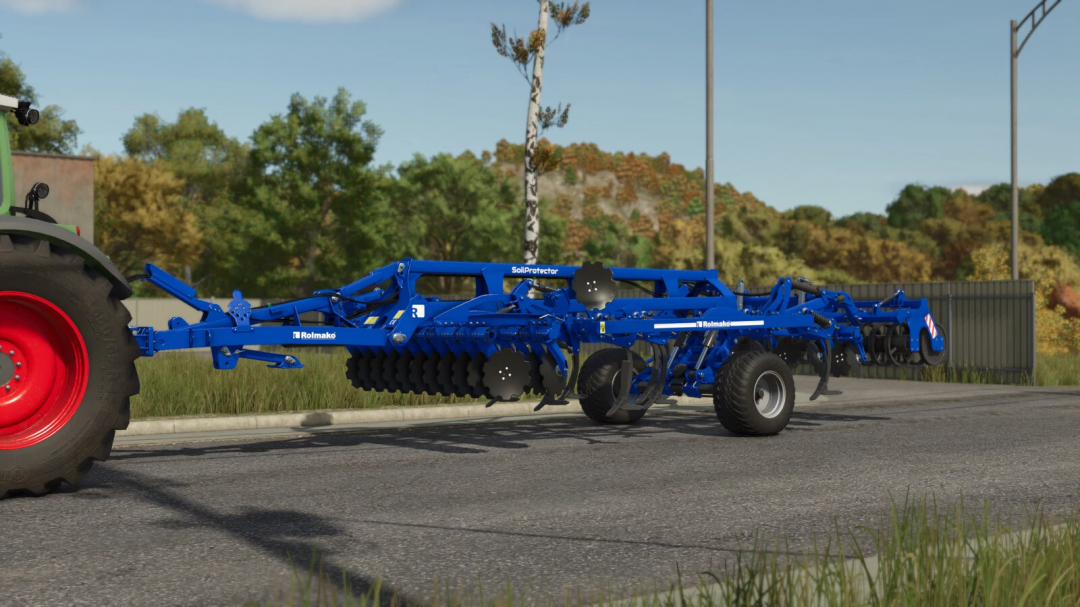 Farming Simulator 25 mod: Rolmako SoilProtector v1.0.0.0, blue soil protection implement attached to tractor on road.
