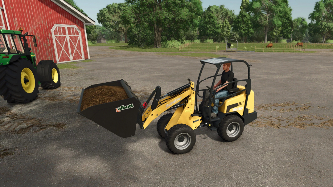 Farming Simulator 25 mod, Schäffer 2630 wheel loader with albutt bucket, on a farmyard with tractor and livestock in the background.