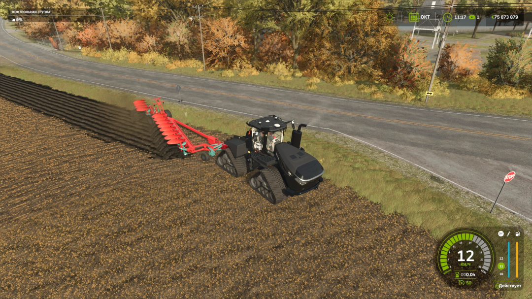 Farming Simulator 25 mod: Black tractor towing a plow on a farm field, with autumn trees and a road in the background.