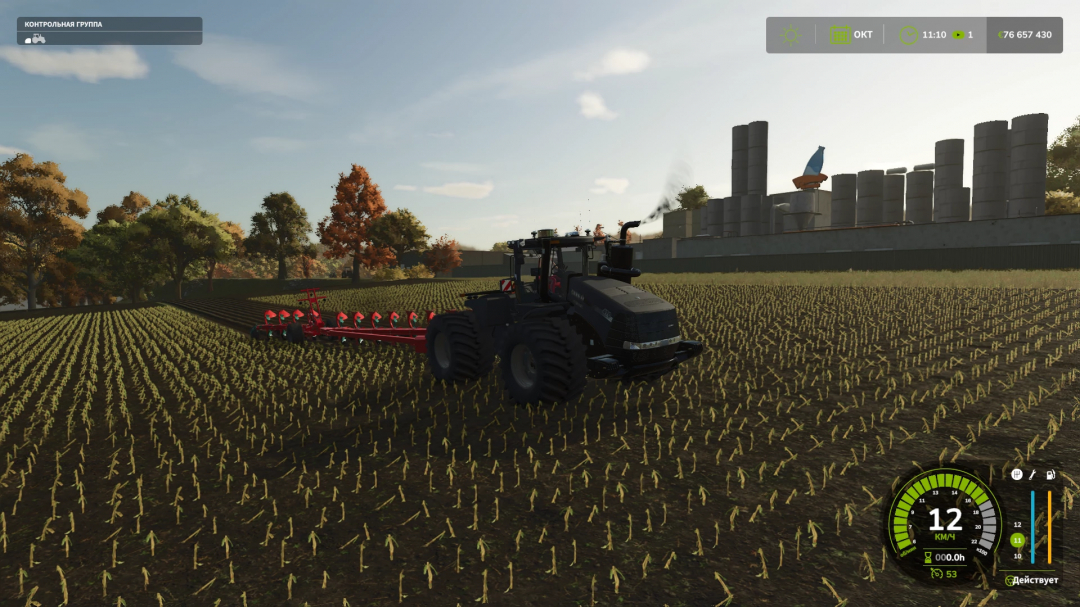 Farming Simulator 25 mod showing a black tractor with a red plow attachment working on a farm field, with industrial silos in the background.
