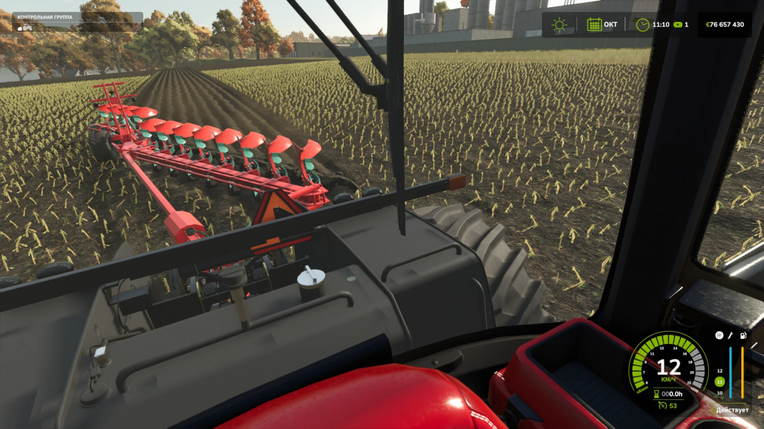 Inside view of a tractor in Farming Simulator 25, displaying a red plow attachment working on a cultivated field, with user interface elements visible.