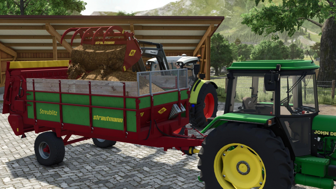 Farming Simulator 25 mods: Green tractor towing a red and green Strautmann Streublitz BE 5 forage wagon filled with hay, with a bale loader attached.