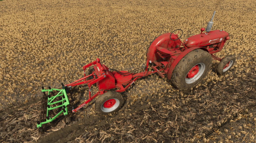 Red vintage tractor pulling a green trailing lifter mod in Farming Simulator 25 on a harvested field.