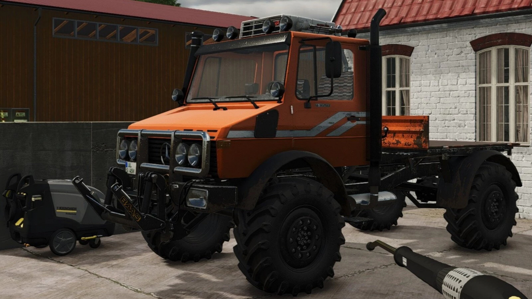 Farming Simulator 25 mod: Unimog U1250, U1450, U1650 with off-road tires, front attachment, and orange body parked near a white brick building.