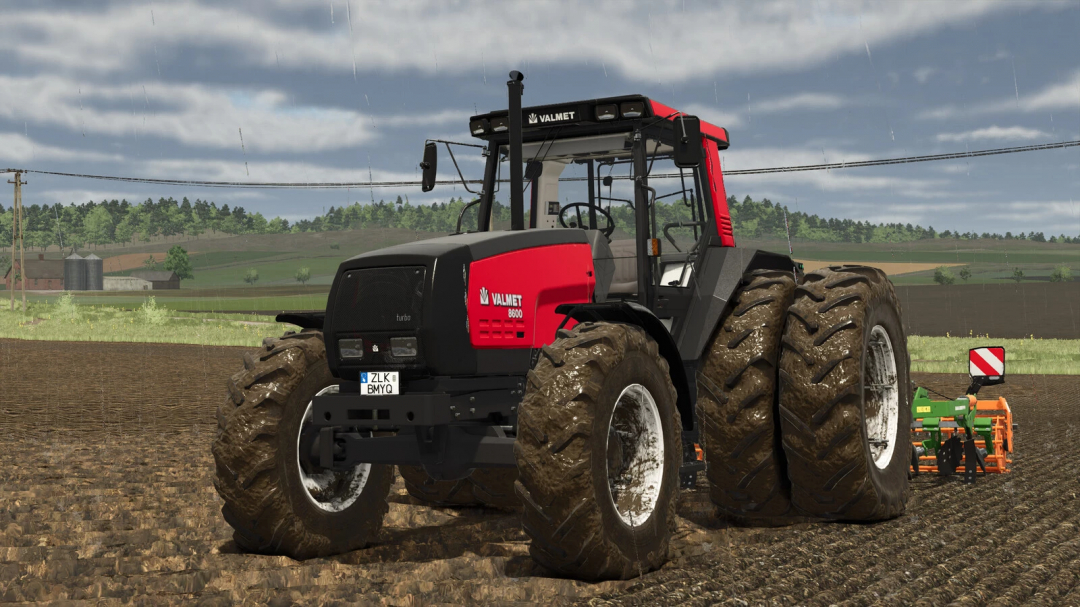 Farming Simulator 25 mod: Valmet MEGA 8300-8800 Series in a muddy field with planting equipment, realistic weather conditions, and lush background.