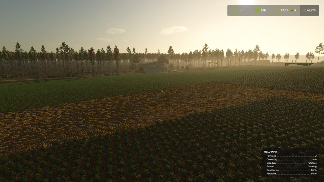 Farming Simulator 25 mod showcasing a vineyard for wine production, with fields, trees, and farm buildings in the distance.