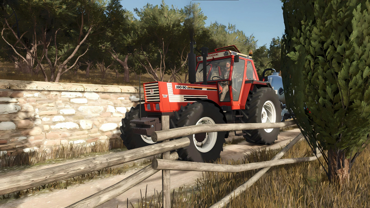 fs25-mods,  Farming Simulator 25 mod featuring a red Fiatagri Series 90 tractor on a farm road beside a stone wall and trees.