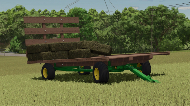 fs25-mods,  Farming Simulator 25 mod: John Deere 1075 Hay Wagon with hay bales, set in a grassy field.