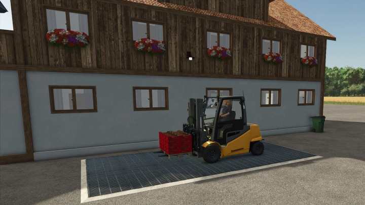 fs25-mods, Farming Simulator 25 mod showcasing a worker using a forklift to transport crates outside a rustic building with window flower boxes.