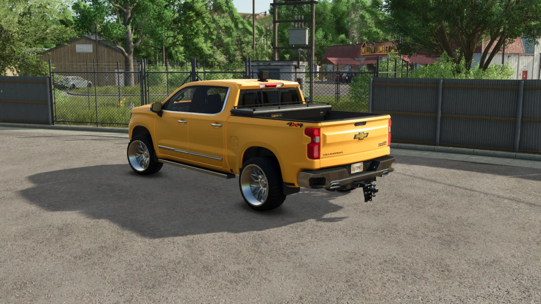 Farming Simulator 25 mod: yellow Chevrolet Silverado 1500 pickup truck with custom wheels and towing hitch, in a farm environment.