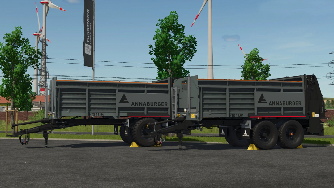 Annaburger HTS 11.04 Spreaders mod from Farming Simulator 25, featured in vibrant gray with red accents, set outdoors with wind turbines in the background.