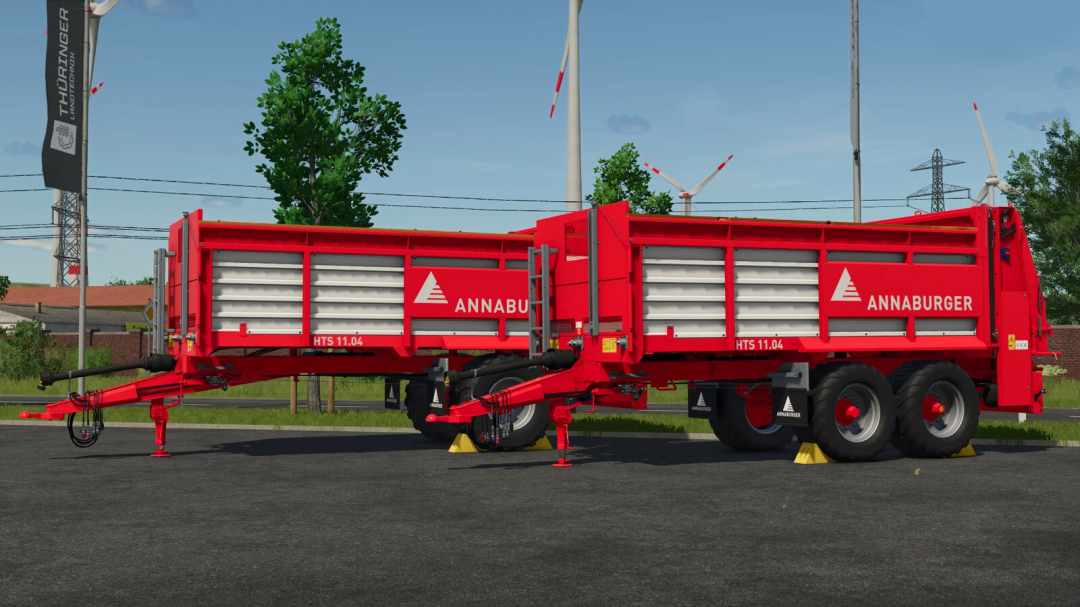 FS25 mod: Annaburger HTS 11.04 spreader in Farming Simulator 25, red color with white logo, mounted on road with trees and wind turbines in background.