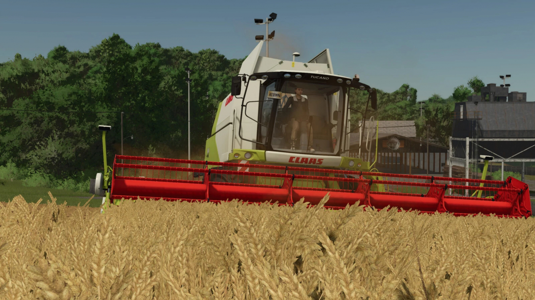 Farming Simulator 25 mod showcasing CLAAS TUCANO 580 harvester in a wheat field with lush green background.