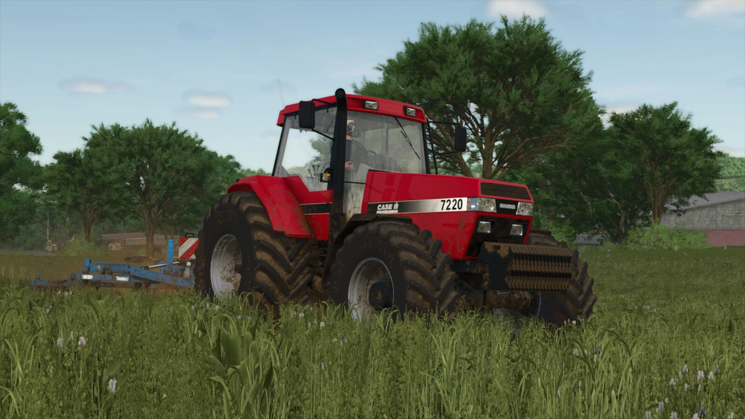 Farming Simulator 25 mod: Red Case IH 7200 Series tractor with attached implement in a grassy field.