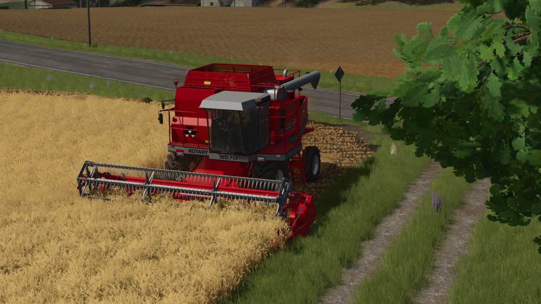 FS25 mod: Combine harvester working in a wheat field, illustrating farming activity in Farming Simulator 25 with realistic graphics.