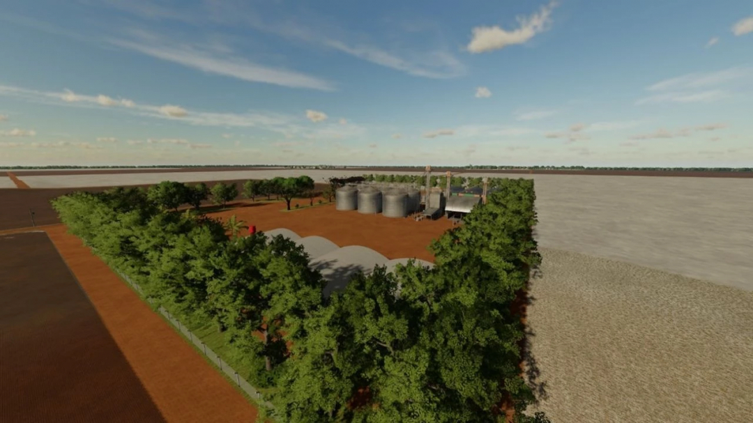 Farming Simulator 22 mod: Fazenda Agroverde Nova Mutum-MT v1.0.0.0 with trees, silos, and farm buildings in a scenic landscape.