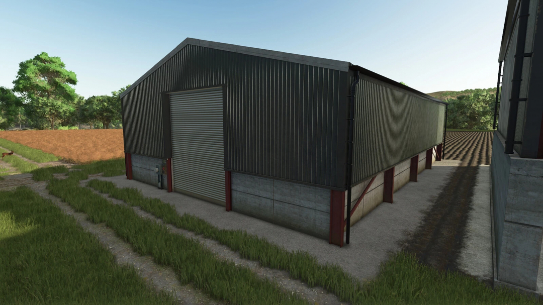 Farming Simulator 25 mod: Grain Shed Pack v1.0.0.0, a large metal grain storage shed with a roller door, in a rural farm setting.