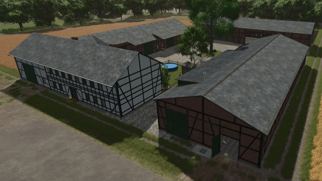 A farmyard with Half-Timbered Farm Buildings mod from Farming Simulator 25, featuring traditional timber frames and farm structures.