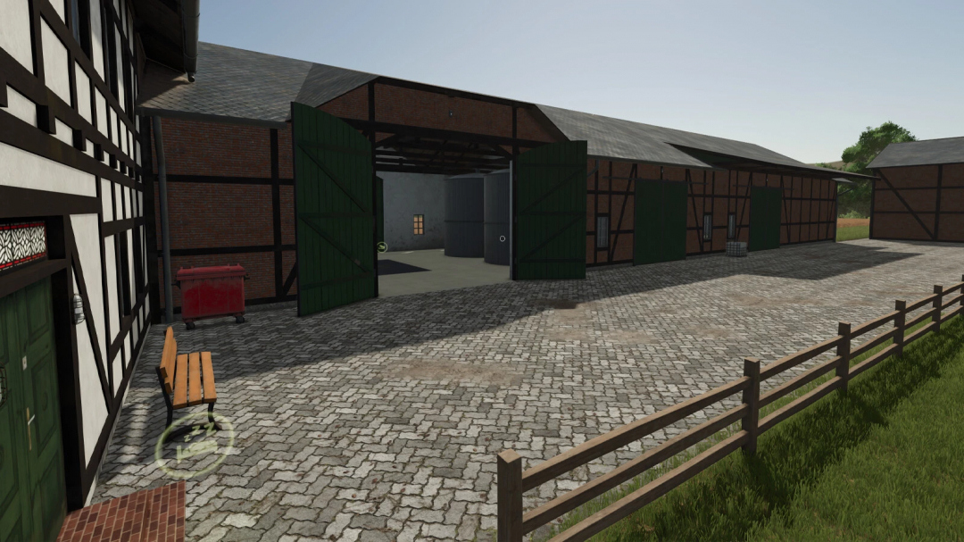 Farming Simulator 25 mod image of a half-timbered farm building with green doors, cobblestone courtyard, and surrounding wooden fence.