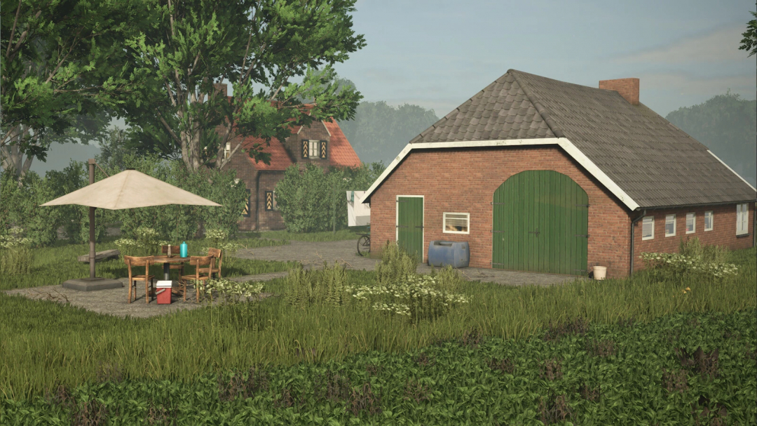 Farmhouse with a green barn, outdoor patio with table, chairs, umbrella, surrounded by greenery in Farming Simulator 25 mods.