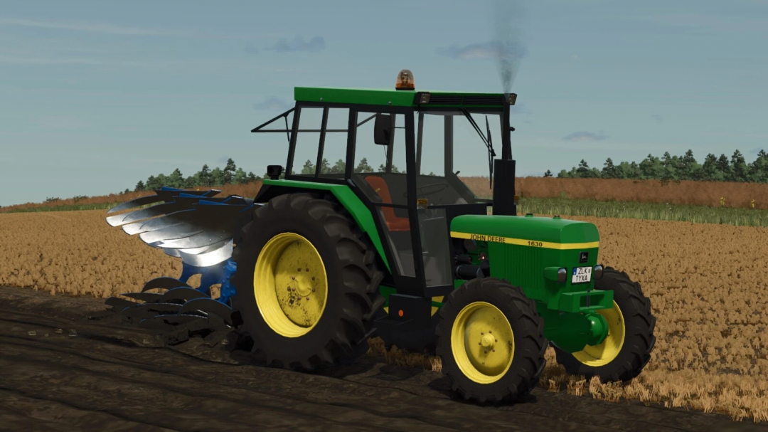 Farming Simulator 25 mod: John Deere 1630 tractor with plow attachment on a plowed field.