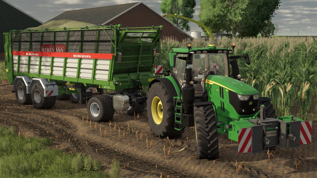 Farming Simulator 25 mod: John Deere tractor with Krampe Dolly 10L trailer on farmland near a cornfield and farm buildings.