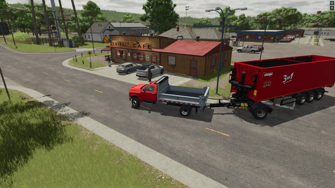Farming Simulator 25 mod: red and gray Krampe Dolly 10L trailer on a country road in front of a cafe in FS25 game.