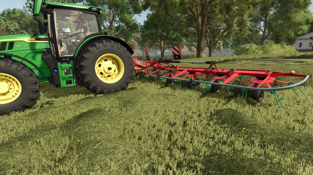 Farming Simulator 25 mod featuring a green John Deere tractor with a red Kverneland 85112 soil cultivator attached, working on a grassy field.