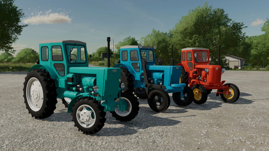 Three vintage tractor mods from Farming Simulator 22 in blue and red colors, displayed outdoors on a gravel surface.