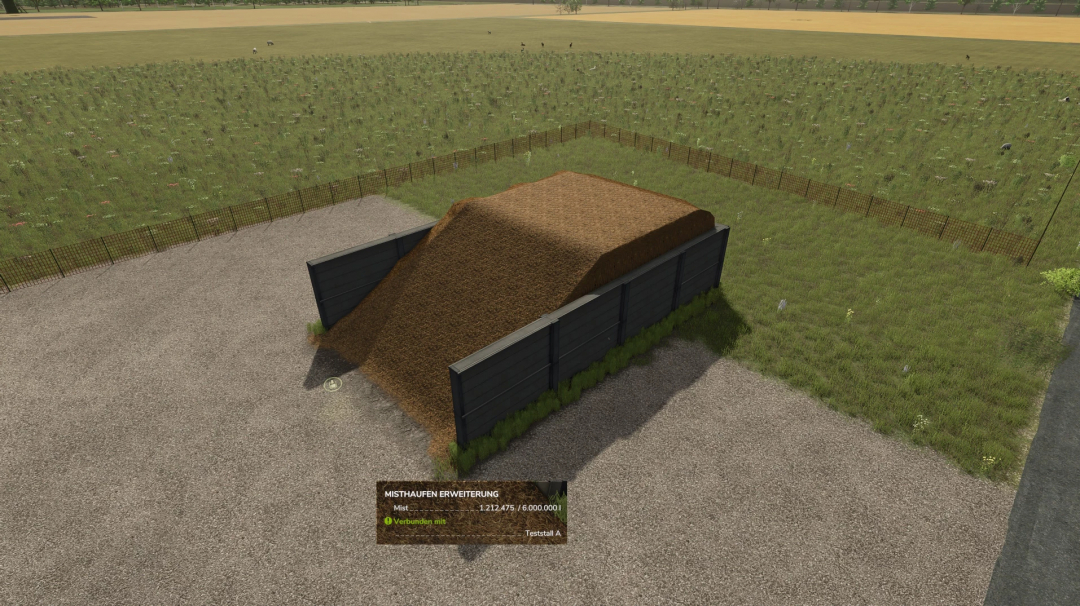 Manure Heap mod in Farming Simulator 25, shown as a large pile of manure in a fenced area with a gravel surface, part of FS25 mods.
