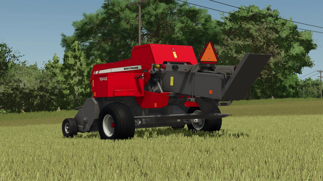 Farming Simulator 25 mod: Massey Ferguson MF 1840 Baler in a grassy field with trees and power lines in the background.