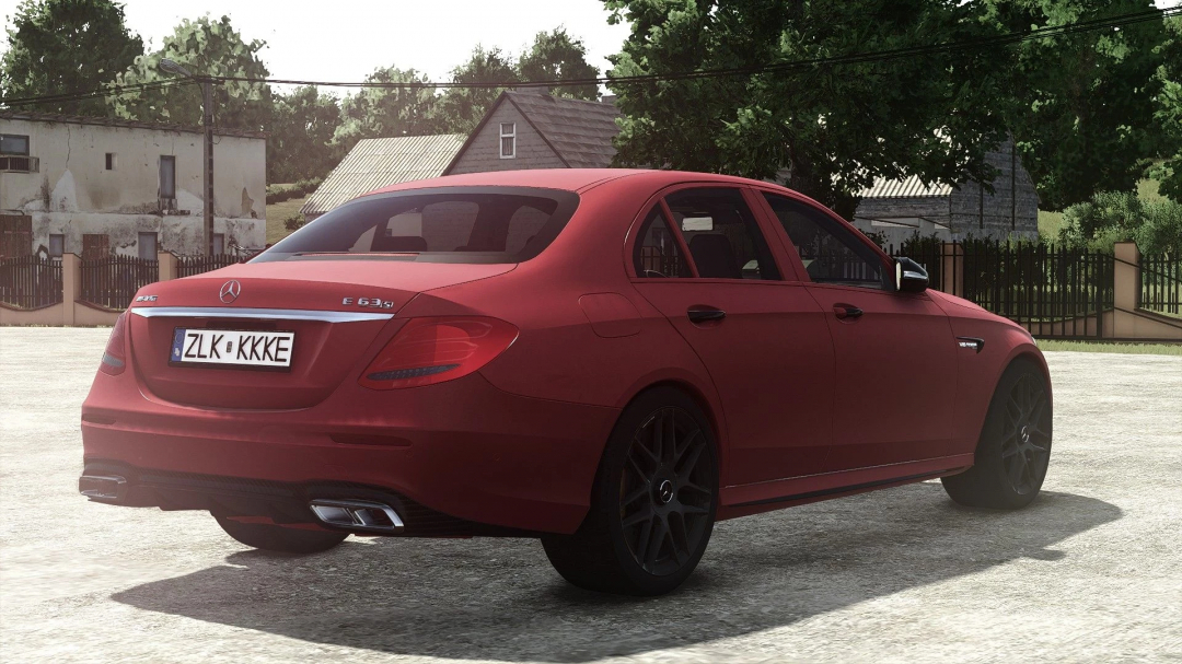 Red Mercedes Benz E63S AMG 2018 mod from Farming Simulator 25, parked outdoors with trees and buildings in the background.