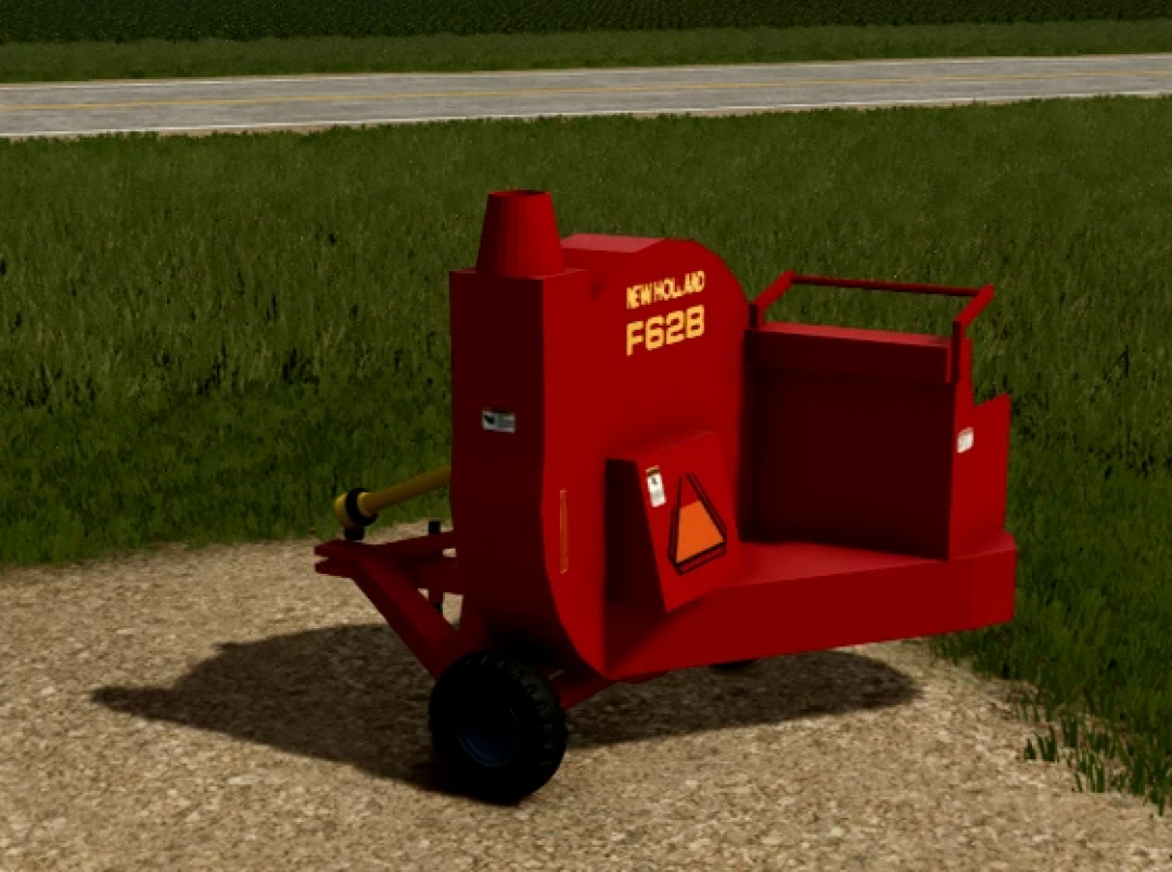 Farming Simulator 25 mod: New Holland F628 silage blower machine on grass field, used for farming and silage collection.