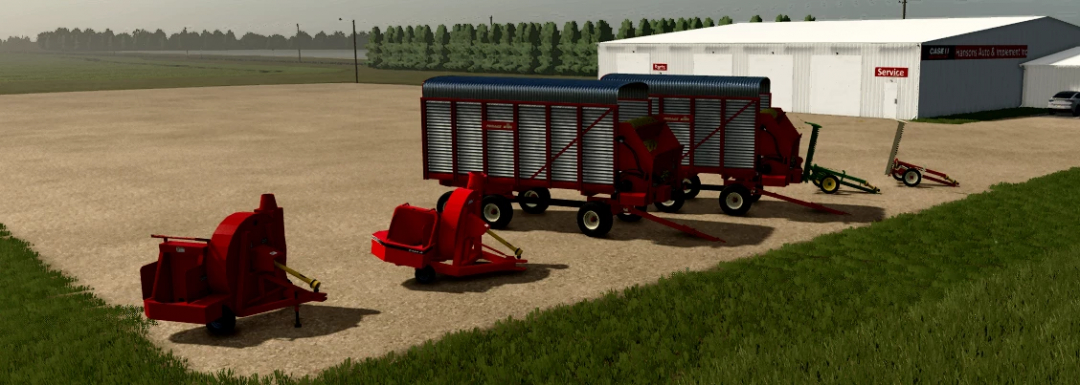Farming Simulator 25 mods: New Holland F62B Silage Blower v1.0.0.0, red silage equipment and trailers on a farm near a workshop building.