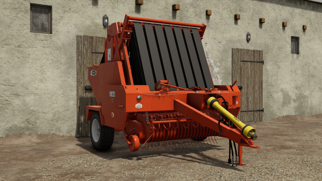 Farming Simulator 25 mod: orange Sipma Z-263 forage harvester with black pick-up reel, parked outside a barn.
