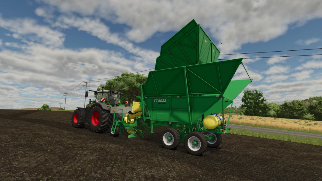 Farming Simulator 25 mods: TT 8022 Drive-less seed drill attached to a tractor, used for planting crops.