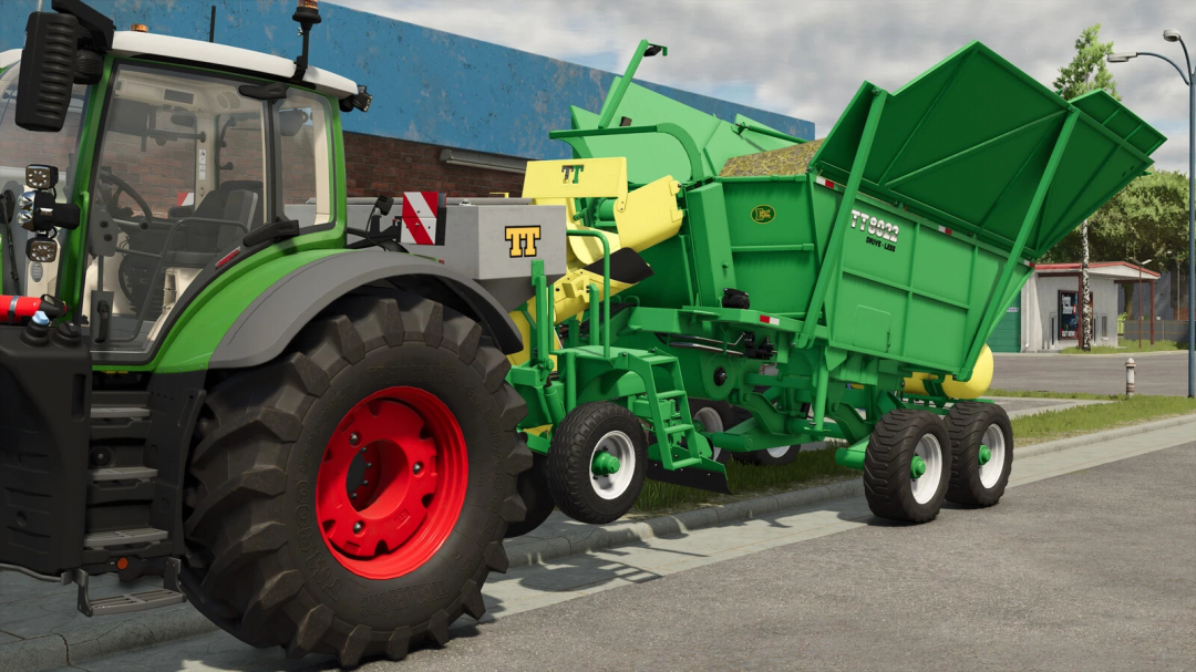 Farming Simulator 25 mod: TT 8022 Drive-less seed and fertilizer spreading machine attached to a tractor on the street.