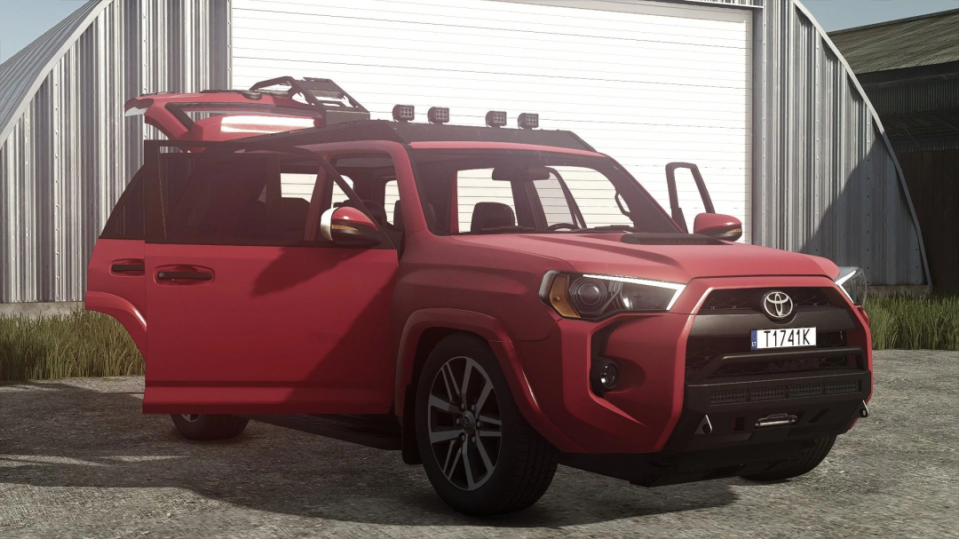 Red Toyota 4Runner 2018 TRD PRO 4x4 mod from Farming Simulator 25, parked outside a barn, realistic game aesthetics.