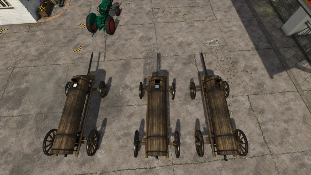 Three wooden wagons from FS25 mods in Farming Simulator 25, placed on a concrete yard with some scattered grain.