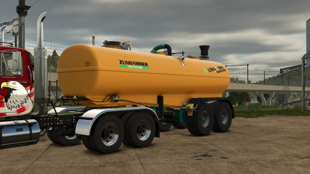 Farming Simulator 25 mods: Zunhammer ULT semi-trailer for transporting liquids, attached to a truck with eagle logo and detailed agricultural background.