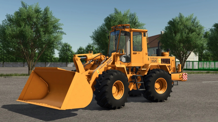 fs25-mods, Farming Simulator 25 mod featuring the Amkodor-352C loader with a yellow design, large wheels, and a front bucket attachment.