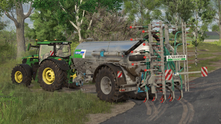 fs25-mods, Farming Simulator 25 mod: Duport PTW 12500 liquid manure spreader attached to a tractor on a farm field.