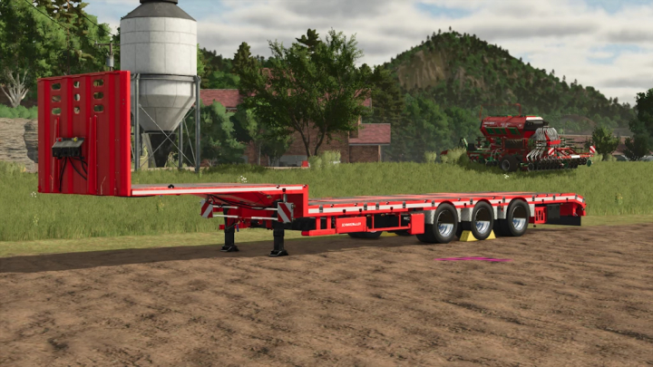 fs25-mods,  Red Farming Simulator 25 mod trailer with multiple axles, farm background including silo and tractor in the distance.