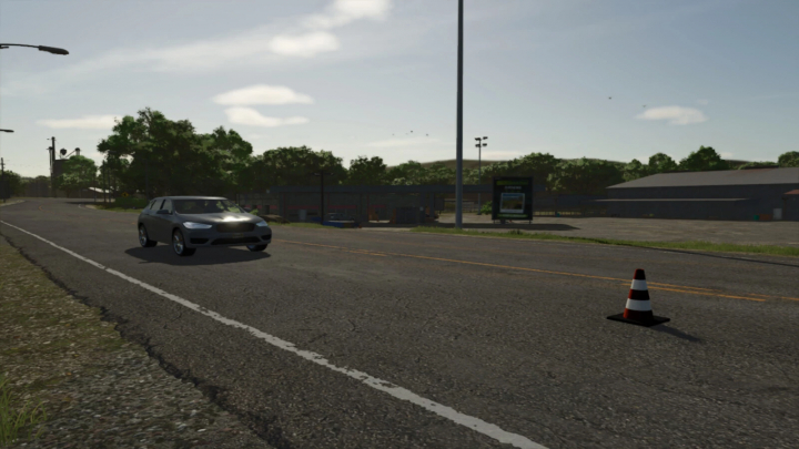 fs25-mods, Farming Simulator 25 mod scene showing a car passing traffic cones on a rural road with trees and a sports field in the background, part of FS25 mods.
