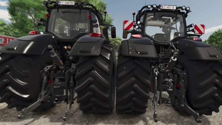 fs25-mods, Two Valtra S BlackedOut tractors from Farming Simulator 25 mods with large rear tires and detailed branding, viewed from the back.