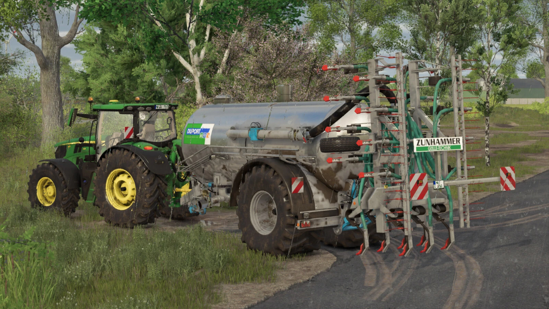 Farming Simulator 25 mod: Duport PTW 12500 liquid manure spreader attached to a tractor on a farm field.