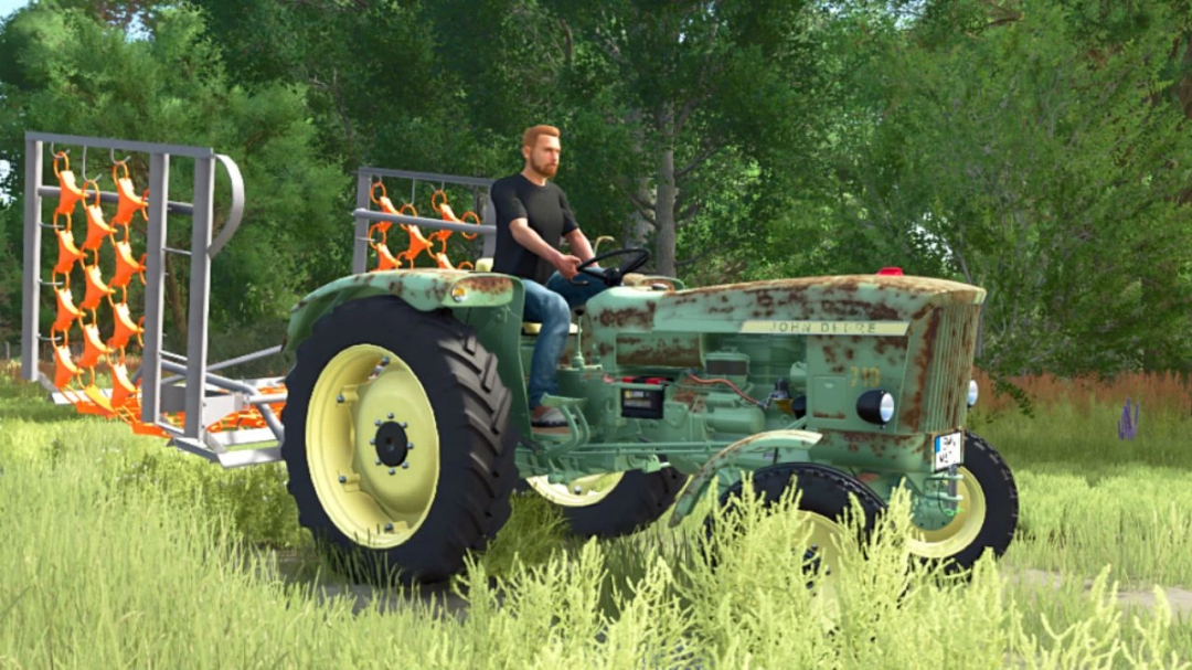 Farming Simulator 25 mod: vintage green tractor with a grassland harrow attachment, used for land preparation in FS25.
