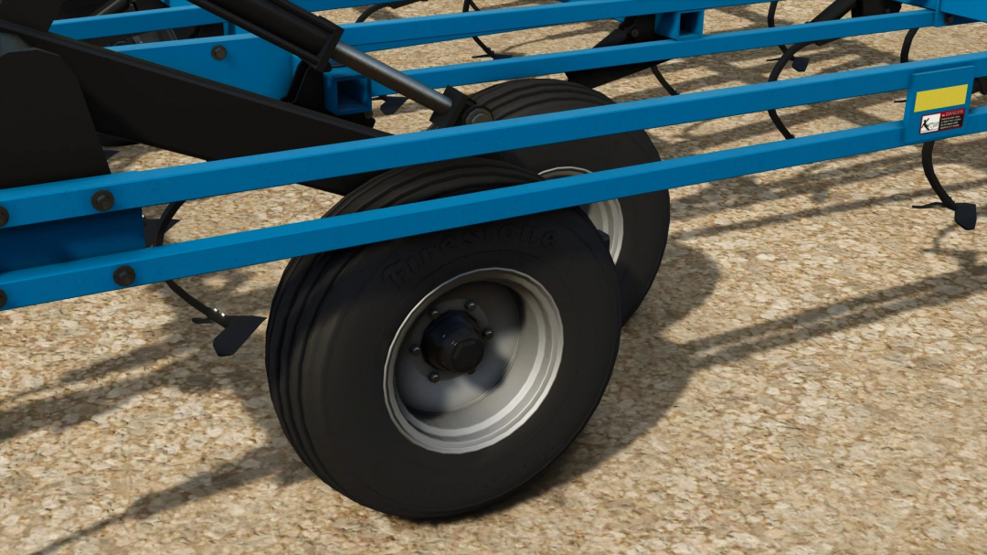 Close-up of a blue Farmtech implement with black tires for Farming Simulator 25 mods in FS25 DMI Tigermate II v1.0.0.0.